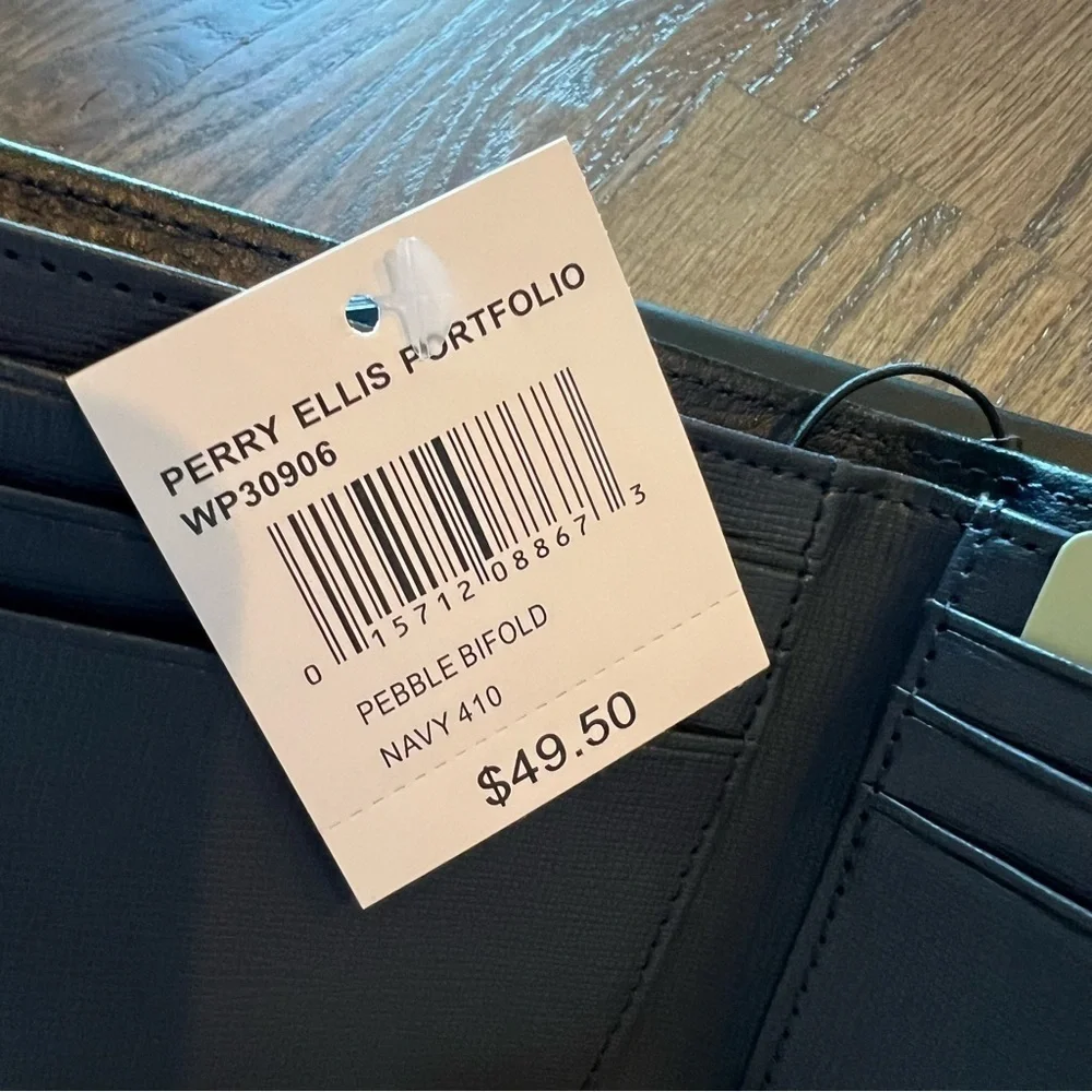 NWT Perry Ellis navy slim bifold leather wallet in box.